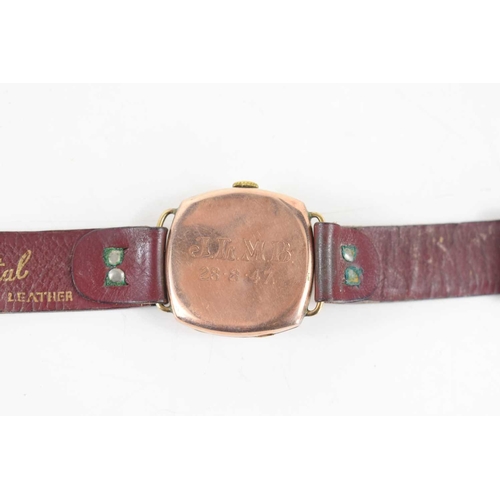 362 - A Rose gold cased Cyma wristwatch with brown leather strap and arabic dial.