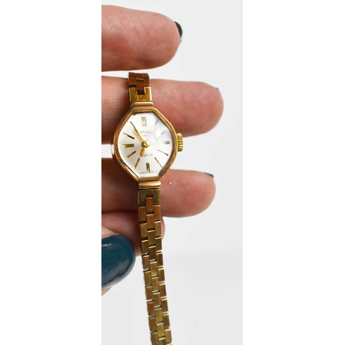 367 - A 9ct gold Rotary ladies wristwatch, with 9ct gold square link strap, 14.10g.