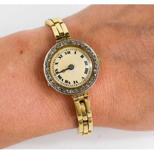 368 - An 18ct gold and diamond ladies wristwatch, the circular Roman numeral dial set with a border of old... 