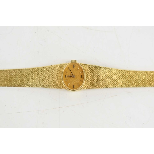 369 - An 18ct gold Omega ladies wristwatch, with matt gold oval dial, 40g.