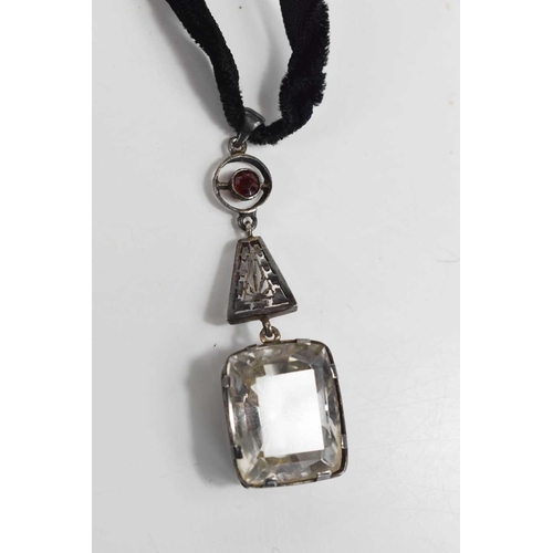 49 - An Art Deco garnet and paste pendant on velvet choker, drop length 58.7mm.