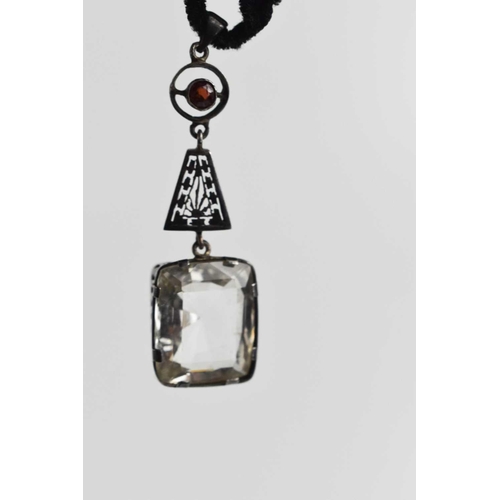 49 - An Art Deco garnet and paste pendant on velvet choker, drop length 58.7mm.