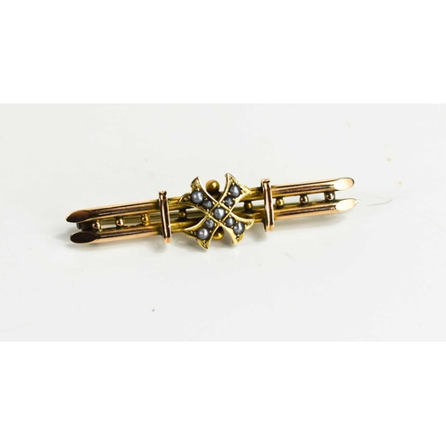 54 - A 9ct gold Victorian brooch, the central cross set with seed pearls, along two bars, with the origin... 