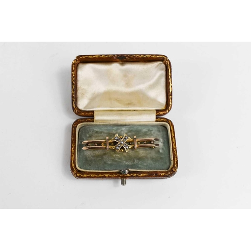 54 - A 9ct gold Victorian brooch, the central cross set with seed pearls, along two bars, with the origin... 