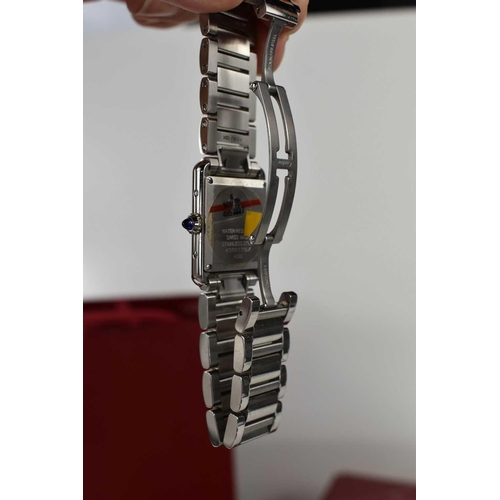 56 - A Cartier Tank Must wristwatch in stainless steel, with a crystal glass front, Roman numeral silvere... 