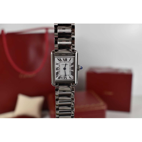 56 - A Cartier Tank Must wristwatch in stainless steel, with a crystal glass front, Roman numeral silvere... 