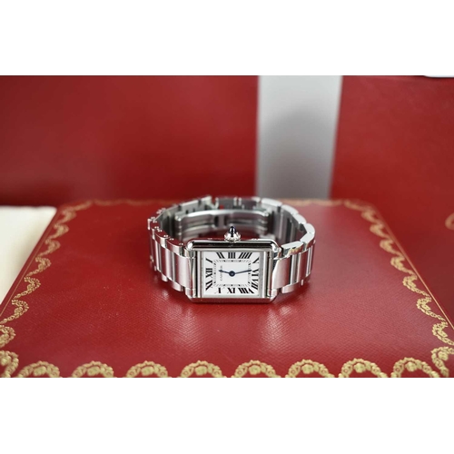 56 - A Cartier Tank Must wristwatch in stainless steel, with a crystal glass front, Roman numeral silvere... 