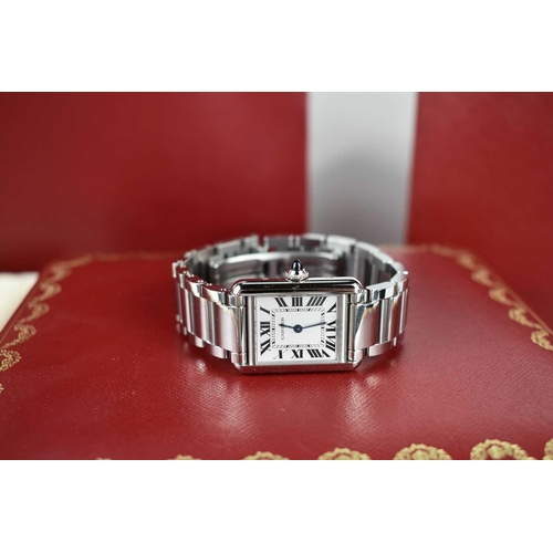 56 - A Cartier Tank Must wristwatch in stainless steel, with a crystal glass front, Roman numeral silvere... 