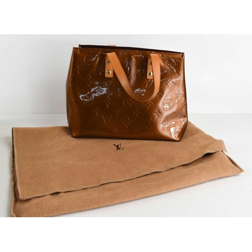 61 - A Louis Vuitton copper coloured patent leather handbag, 25cm wide.