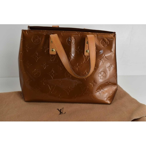 61 - A Louis Vuitton copper coloured patent leather handbag, 25cm wide.