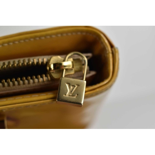 62 - A Louis Vuitton gold coloured patent leather handbag, 31cm.