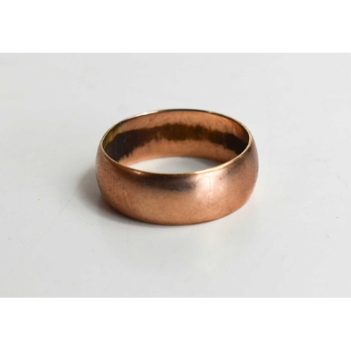 64 - A 9ct rose gold wedding band, size M/N, 3.2g.