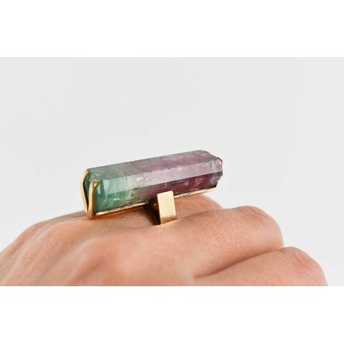 7 - A 9ct gold and watermelon tourmaline cocktail dress ring, the large and impressive baguette cut ston... 