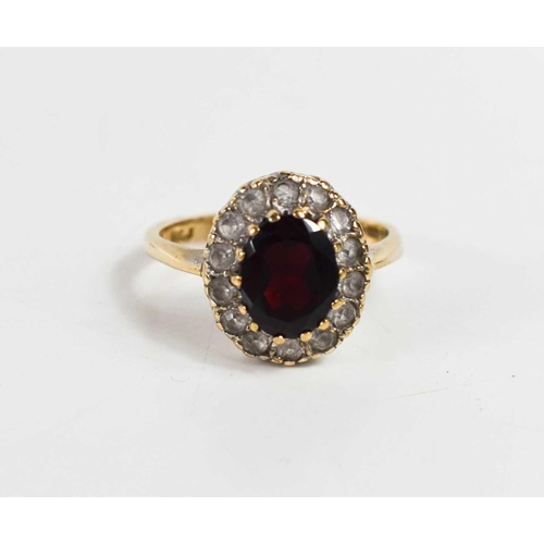 72 - A 9ct gold, garnet and cubic zirconia dress ring, size P, 4.1g.