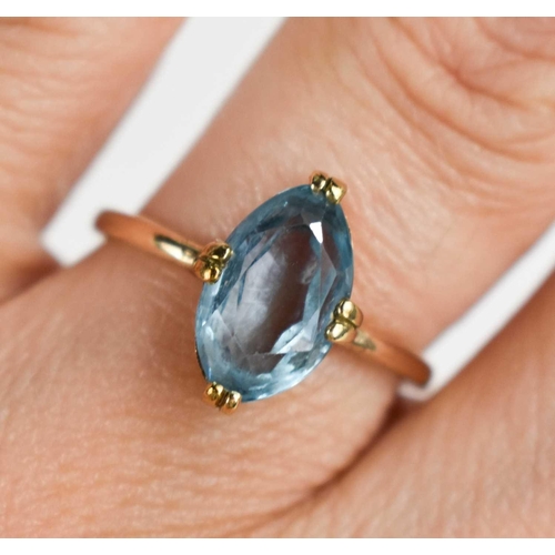 87 - A blue paste set dress ring, the oval stone of approximately 11 by 6mm, size N, 2.2g. This is not te... 