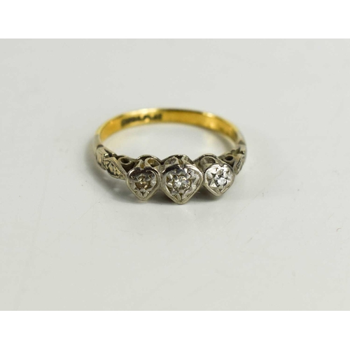 96 - An 18ct gold and platinum diamond ring, set in three graduated hearts, size K, 2.8g.