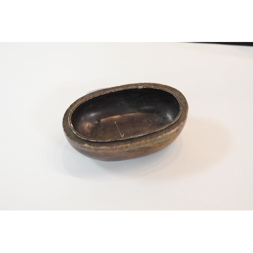 93 - A Chinese soapstone box and cover of oval form the top carved with two dogs of Fo, and a flaming pea... 