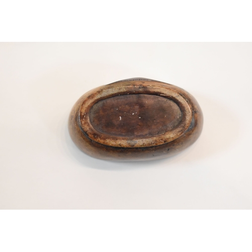 93 - A Chinese soapstone box and cover of oval form the top carved with two dogs of Fo, and a flaming pea... 