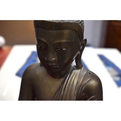 103 - An early 20th century Burmese Buddha statue in cast bronzed metal, with inscription to the front, tr... 