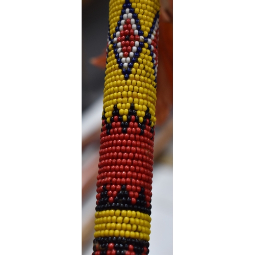 370 - A group of African and Native American items to include a Maasai beaded wedding necklace, a beaded w... 