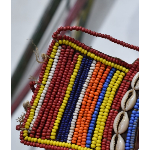 370 - A group of African and Native American items to include a Maasai beaded wedding necklace, a beaded w... 