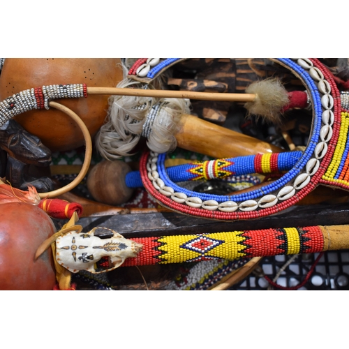 370 - A group of African and Native American items to include a Maasai beaded wedding necklace, a beaded w... 