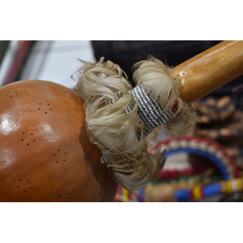 370 - A group of African and Native American items to include a Maasai beaded wedding necklace, a beaded w... 