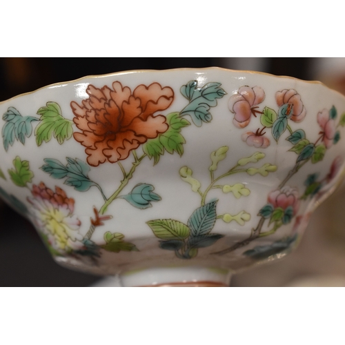 8 - A Chinese Canton Famille Rose pedestal bowl, decorated with chrysanthemums and blossom, above a foli... 