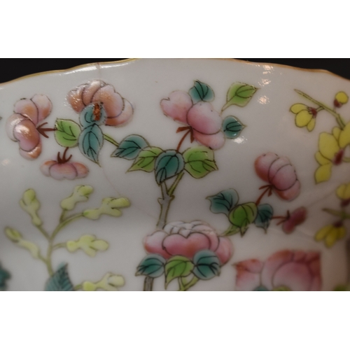 8 - A Chinese Canton Famille Rose pedestal bowl, decorated with chrysanthemums and blossom, above a foli... 