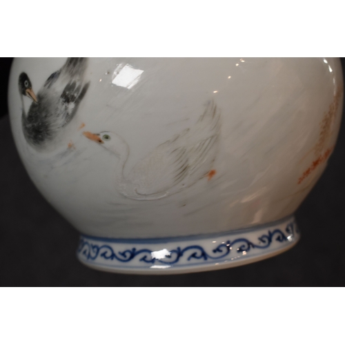 35 - A 20th century Chinese bottle vase, in underglaze blue and white, and overglazed hand painted ducks ... 