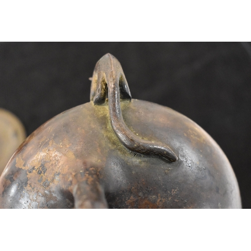 112 - An early Chinese bronze censor and cover / stand, the twin handles in the form of animals and raised... 