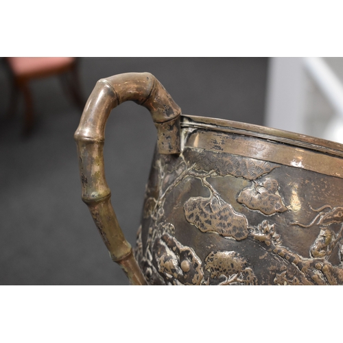 109 - An early 20th century Chinese silver trophy by Luen Wo, Shanghai, with chased and repousse hunting s... 