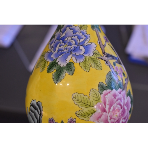 131 - A pair of Chinese cloisonne vases, the yellow ground with birds amongst tree peonies, chrysanthemums... 