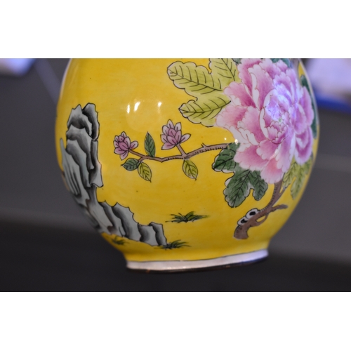 131 - A pair of Chinese cloisonne vases, the yellow ground with birds amongst tree peonies, chrysanthemums... 