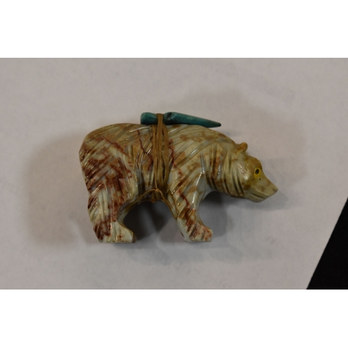 362 - A group of Native American carved animal fetishes and beads to include a wolf with turquoise eyes, a... 