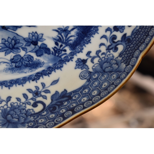 19 - A Chinese blue and white dish, possibly of the Nankin Cargo, with rust coloured wavy edge, depicting... 