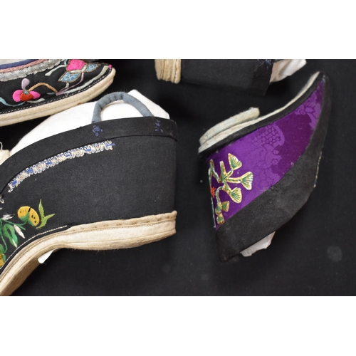 188 - Four pairs of Chinese 19th century Qing Dynasty hand embroidered lotus shoes, of various regional de... 