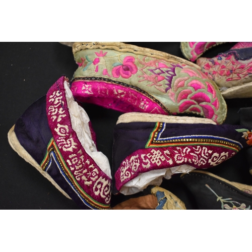 187 - Four pairs of Chinese late 19th / early 20th century Qing Dynasty hand embroidered lotus shoes, of v... 