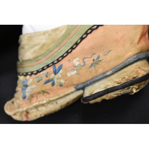 186 - Two pairs of Chinese 19th century Qing Dynasty hand embroidered lotus shoes, each of regional design... 