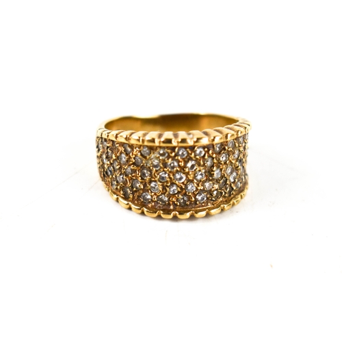 105 - A 9ct gold and diamond modernist dress ring, the wide band studded with diamonds, with scalloped edg... 