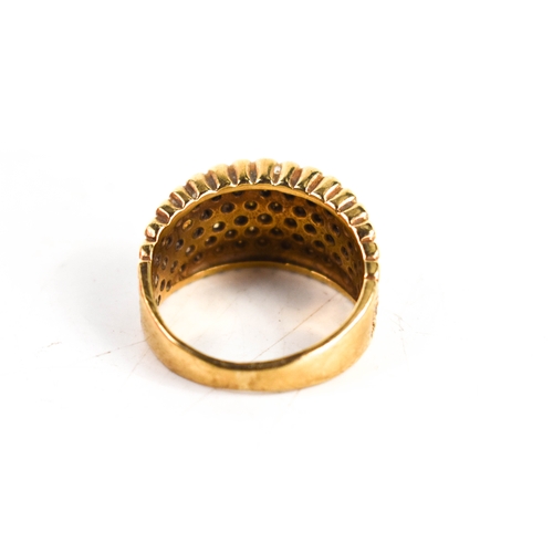 105 - A 9ct gold and diamond modernist dress ring, the wide band studded with diamonds, with scalloped edg... 