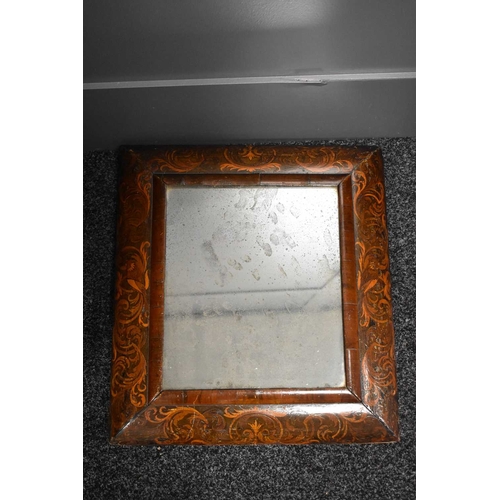 124 - A Queen Anne period walnut seaweed marquetry cushion mirror, with the original rectangular mirror, 5... 