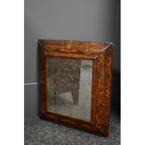 124 - A Queen Anne period walnut seaweed marquetry cushion mirror, with the original rectangular mirror, 5... 