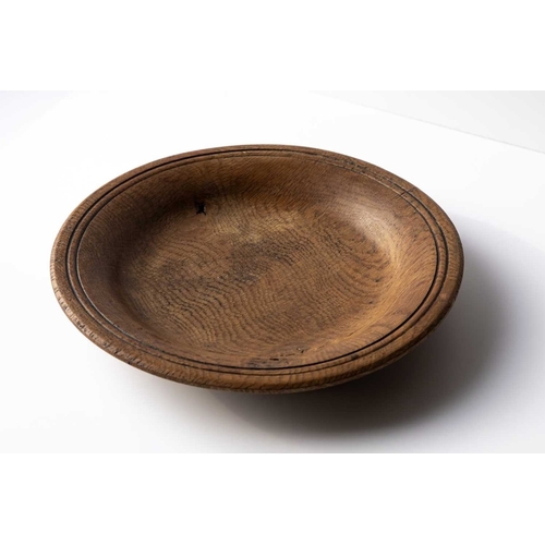 141 - An early Scottish provincial Oak Platter, a charming late 18th or early 19th century Scottish oak pl... 