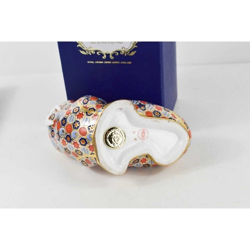 154 - A Royal Crown Derby paperweight in the form of a walrus, with gold stopper and original box, 11cm ta... 