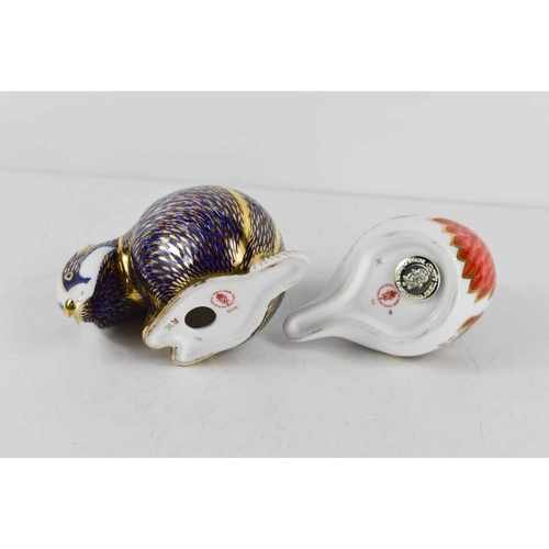 156 - Two Royal Crown Derby paperweights, one in the form of a badger (lacking stopper) the other in the f... 