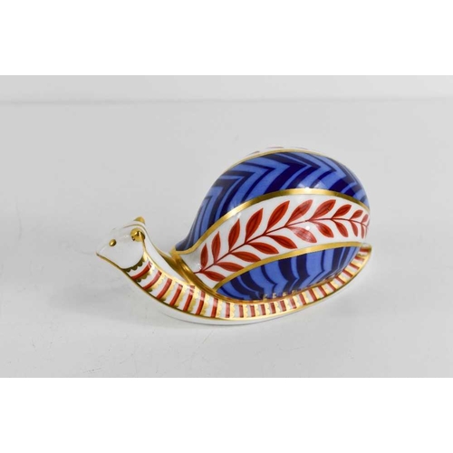 165 - A Royal Crown Derby paperweight in the form of a snail, with silver stopper, 13cm long.