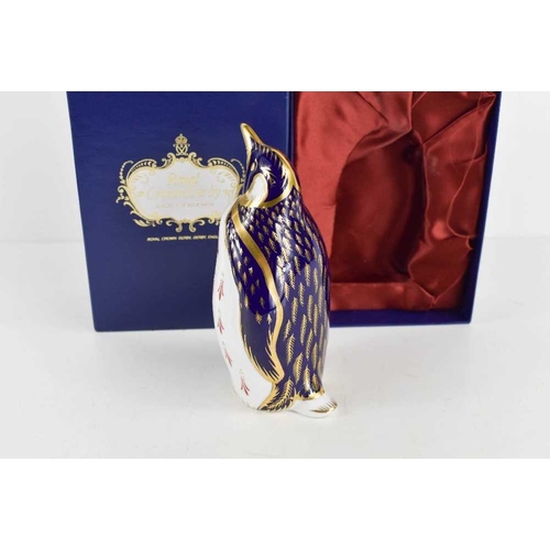 166 - A Royal Crown Derby paperweight in the form of a penguin, with original box, gold stopper, 13cm high... 