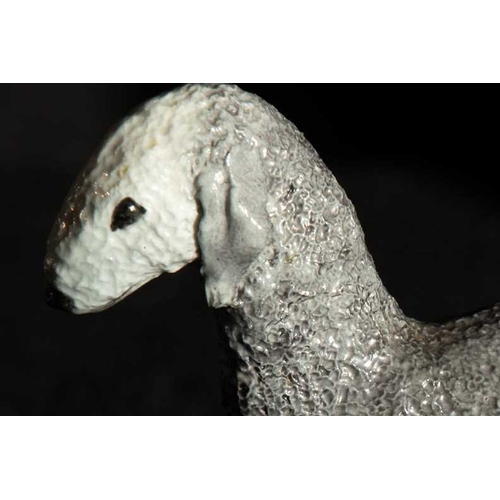 199 - A finely detailed porcelain Bedlington Terrier, synonymous with artist Cragie Aitichson, 12cm tall x... 