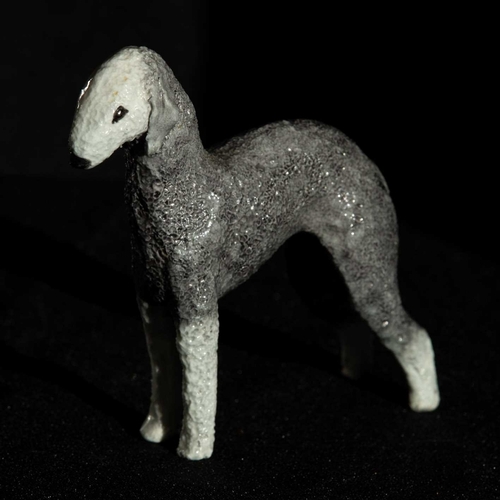 199 - A finely detailed porcelain Bedlington Terrier, synonymous with artist Cragie Aitichson, 12cm tall x... 